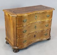 A 19th century inlaid oak serpentine commode, fitted with three drawers, on bun feet, W.3ft 10in.