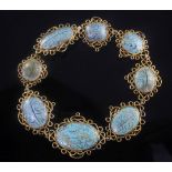 A late 19th century Middle Eastern? gold and turquoise set bracelet, each cabochon inlaid with