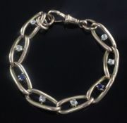 An early 20th century 9ct gold, sapphire and diamond bracelet, set with six diamonds and two