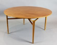 A 1960's teak centre table, with circular top and Y form legs, diameter 3ft 6.5in. H.1ft 10in.
