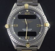 A gentleman's Breitling Aerospace titanium quartz wristwatch, with digital and analogue blue dial,