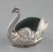 A large Edwardian novelty silver pin cushion modelled as a swan by Grey & Co, with inset leatherette