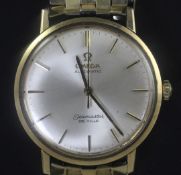 A gentleman's gold Omega Seamaster de Ville automatic wrist watch, with baton numerals, on Omega