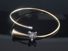 An Edwardian novelty gold, silver and rose cut diamond set bangle modelled as a hunting horn with