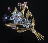 A large yellow metal and multi gem set floral spray trembleuse brooch, (a.f.). 11cm