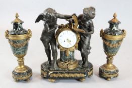 An early 20th century French bronzed spelter, ormolu and green marble clock garniture, the mantel
