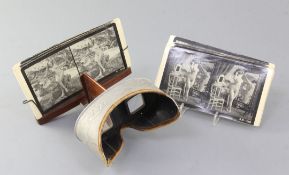 A late 19th / early 20th century Underwood & Underwood stereoscopic slide viewer, with a selection