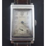 A gentleman's 1930's stainless steel Rolex manual wind wrist watch, with rectangular Arabic dial and