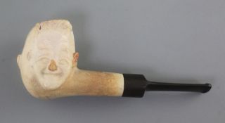 Laurel & Hardy Interest: A 1930's meerschaum pipe, the bowl carved in relief to each side with the