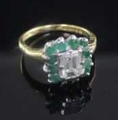 A 1980's 18ct gold, diamond and emerald cluster ring, of square form, the central emerald cut