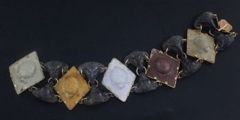 A 19th century Italian yellow metal mounted variegated lava bracelet, with ram's head link and