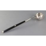 An early 19th century Italian 800 standard silver punch ladle, with ebonised handle, maker's mark