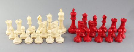 An early 20th century Staunton pattern carved and stained ivory chess set, with mahogany box,