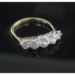 A mid 20th century gold and graduated five stone diamond ring, size N.