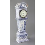 A Delft blue and white model of a longcase timepiece, c.1900, decorated with figures, diaper and