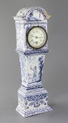 A Delft blue and white model of a longcase timepiece, c.1900, decorated with figures, diaper and
