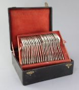 A cased set of late 19th century French 950 standard silver fiddle, thread and shell pattern