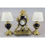 A French ormolu and bleu du rois porcelain clock garniture, with central urn shaped clock, 22in.,