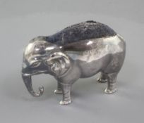 An Edwardian novelty silver pin cushion, modelled as an elephant by Britton, Gould & Co, Birmingham,