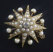 An Edwardian gold, split pearl and diamond set starburst pendant brooch, 29mm.