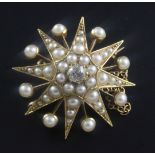 An Edwardian gold, split pearl and diamond set starburst pendant brooch, 29mm.