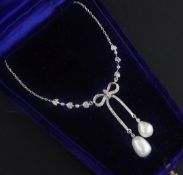 A Belle Epoque white metal natural saltwater pearl and diamond set double drop pendant necklace,