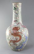 A large Chinese famille rose enamelled 'dragon' bottle vase, late 19th century, with a crackle glaze