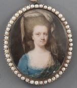 18th century English Schooloil on ivoryMiniature of a lady with elaborate hair and bonnet