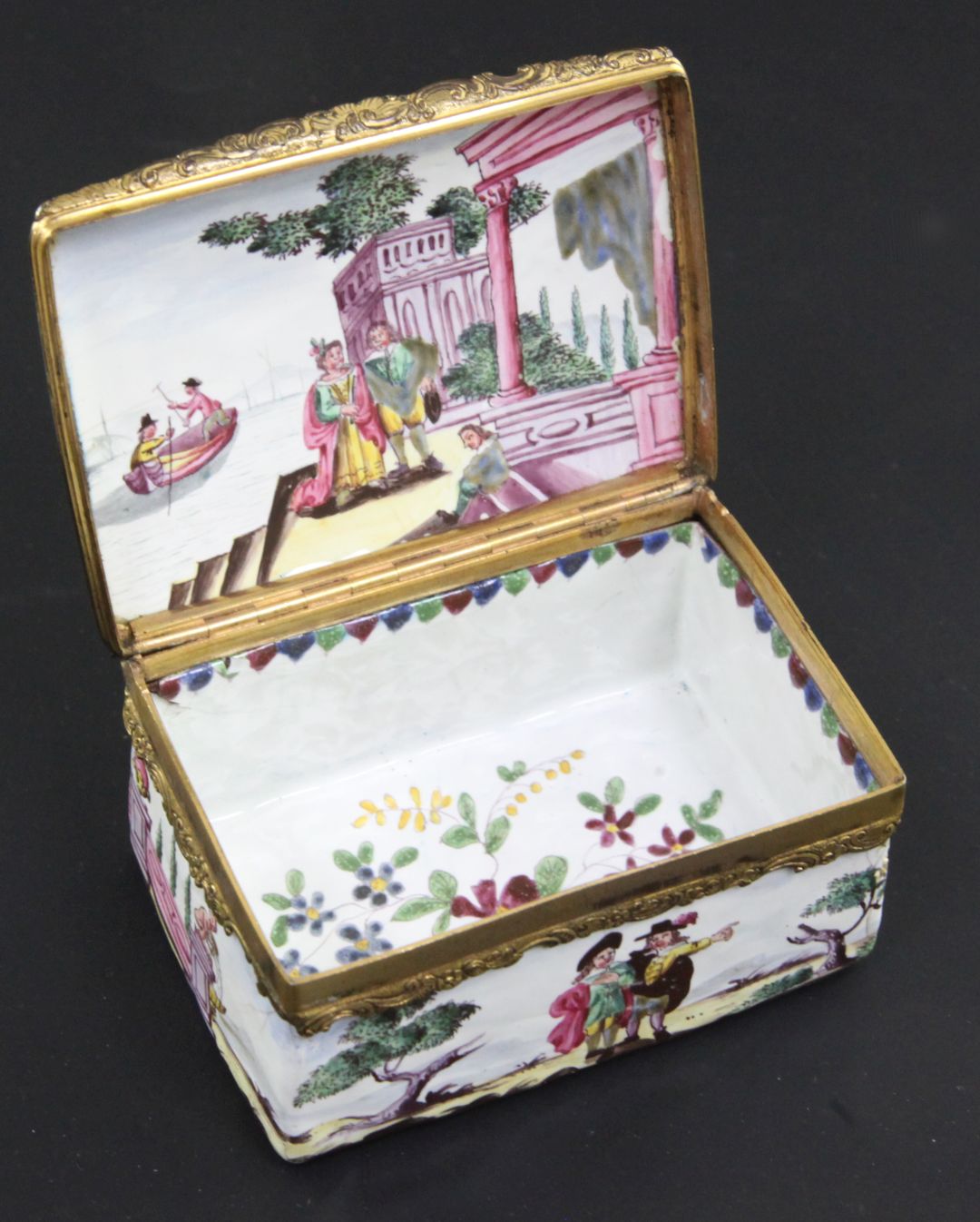 A 19th century Continental enamel snuff box, with gilt hinge, decorated with figures in harbours, - Image 2 of 2
