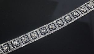A Victorian gold, silver and diamond encrusted bracelet, the pierced square links set with