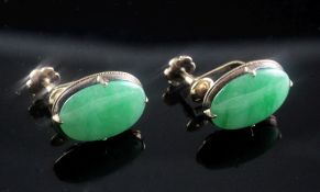 A pair of Chinese gold and oval cabochon jadeite ear clips, with character marks, 17mm.