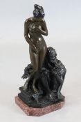 A bronze group of an Arab and slave girl, indistinctly signed, on rouge marble plinth, 26.5in.