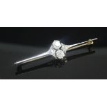 An early 20th century gold and diamond cluster bar brooch, set with four old cushion cut stones, the