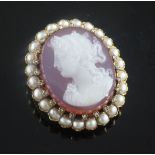 A late 19th/early 20th century French 18ct gold, diamond and split pearl set oval hardstone cameo