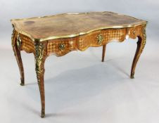 A Louis XV style kingwood and parquetry bureau plat, with tooled olive green skiver and three