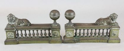 A pair of 19th century patinated brass andirons, decorated with lions, 20in.