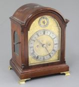 An Edwardian mahogany small bracket clock, with arched mahogany case, silvered and parcel gilt brass