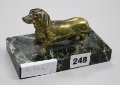 A bronze daschund on marble vase