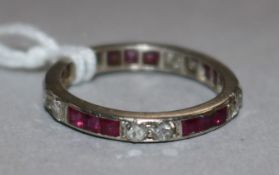 A white metal ruby and diamond eternity ring, size K.