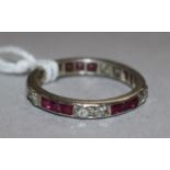 A white metal ruby and diamond eternity ring, size K.