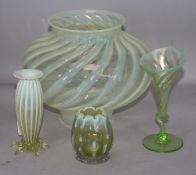 A vaseline glass lamp shade and three vases