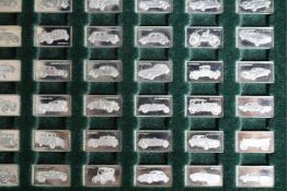 A collection of silver miniature ingots, 100 greatest cars.