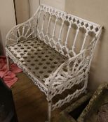 A Victorian style white painted cast iron garden bench, W.88cm