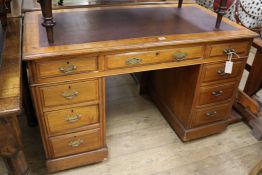 An Edwardian walnut pedestal desk, W.122cm