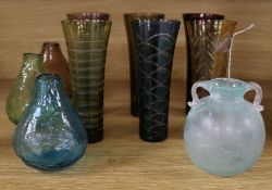 A collection of six overlay coloured glass tumblers, three pots and a Roman style vessel