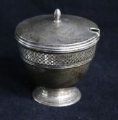 A Tiffany & Co sterling silver vase-shaped sugar bowl and cover, with ovoid finial and pierced