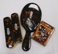 A tortoiseshell card case, a snuff box and a brush set