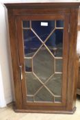 A mahogany glazed hanging corner cabinet, H.100cm