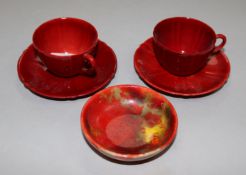 Royal Doulton flambé - two coffee cups and a small dish