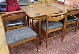 A Mackintosh extending dining table and eight chairs, 236cm fully extended